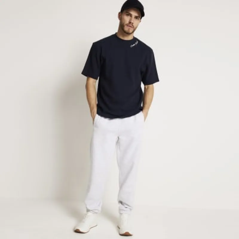 Navy oversized textured embroidered t-shirt sold by River Island