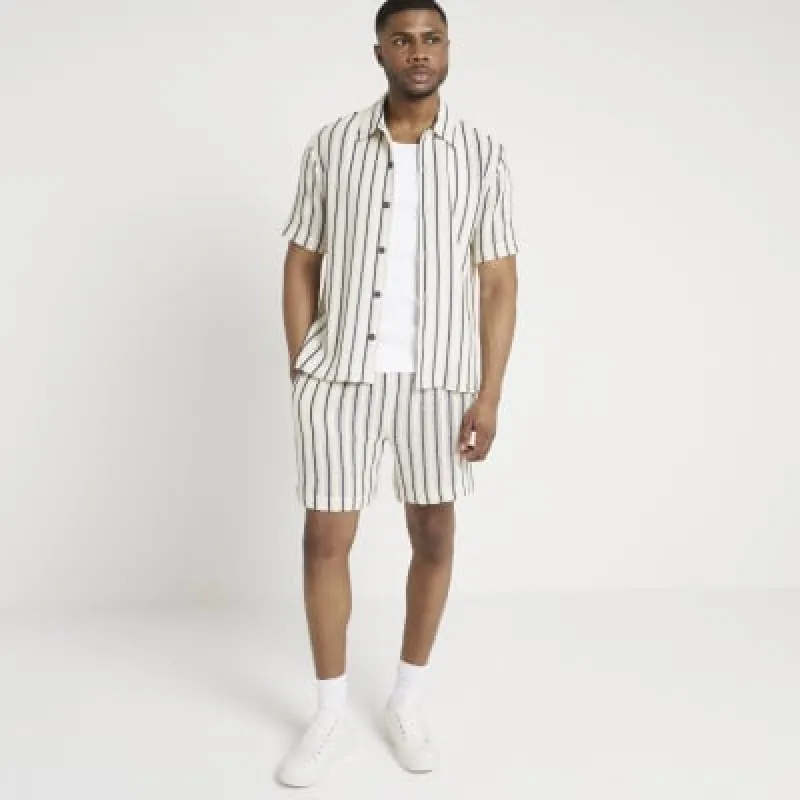 Beige regular fit crochet stripe shorts sold by River Island