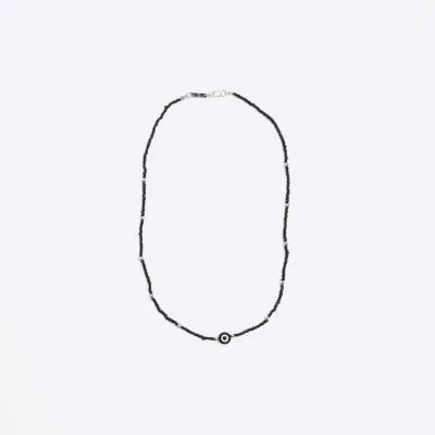 Black delicate evil eye necklace sold by River Island