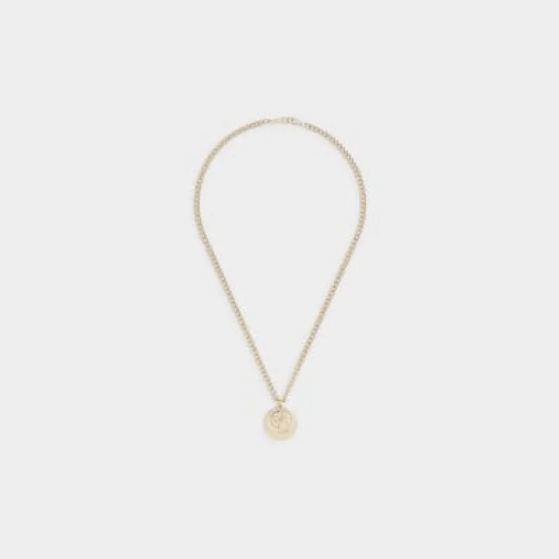Gold colour coin necklace sold by River Island
