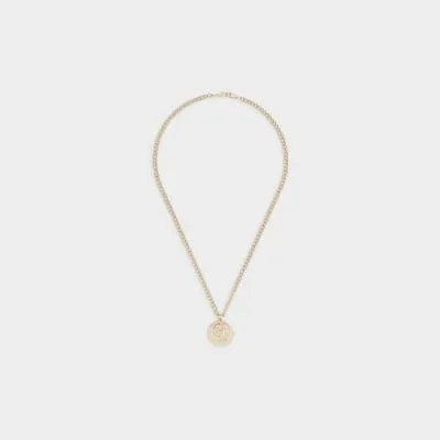 Gold colour coin necklace sold by River Island