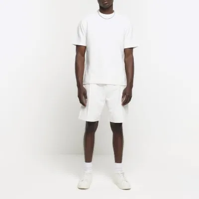 Beige regular fit textured smart shorts sold by River Island