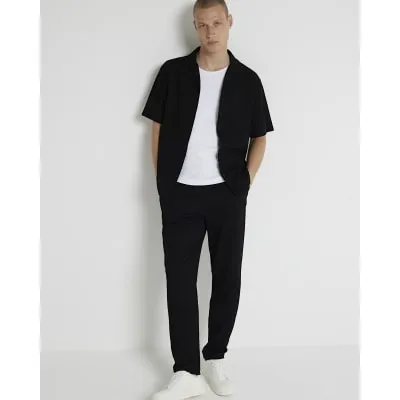 Black regular fit plisse joggers sold by River Island