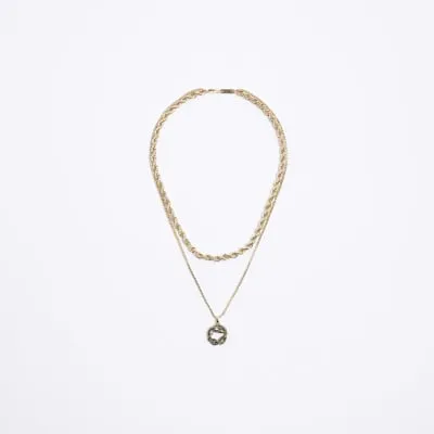 Gold colour snake pendant necklace sold by River Island