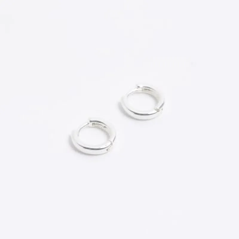 Silver colour hoop earrings sold by River Island
