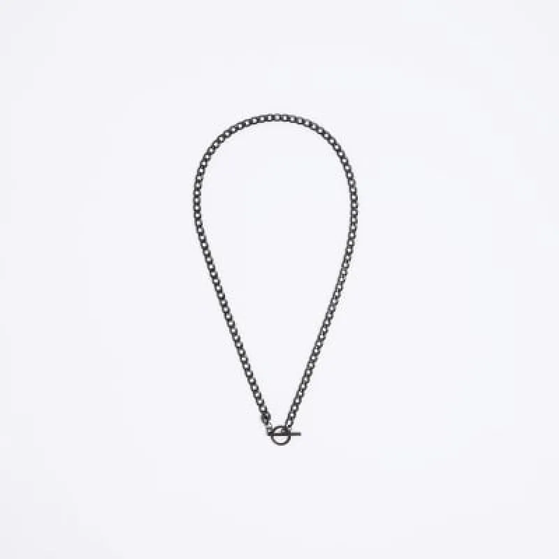 Black stainless steel T bar necklace sold by River Island