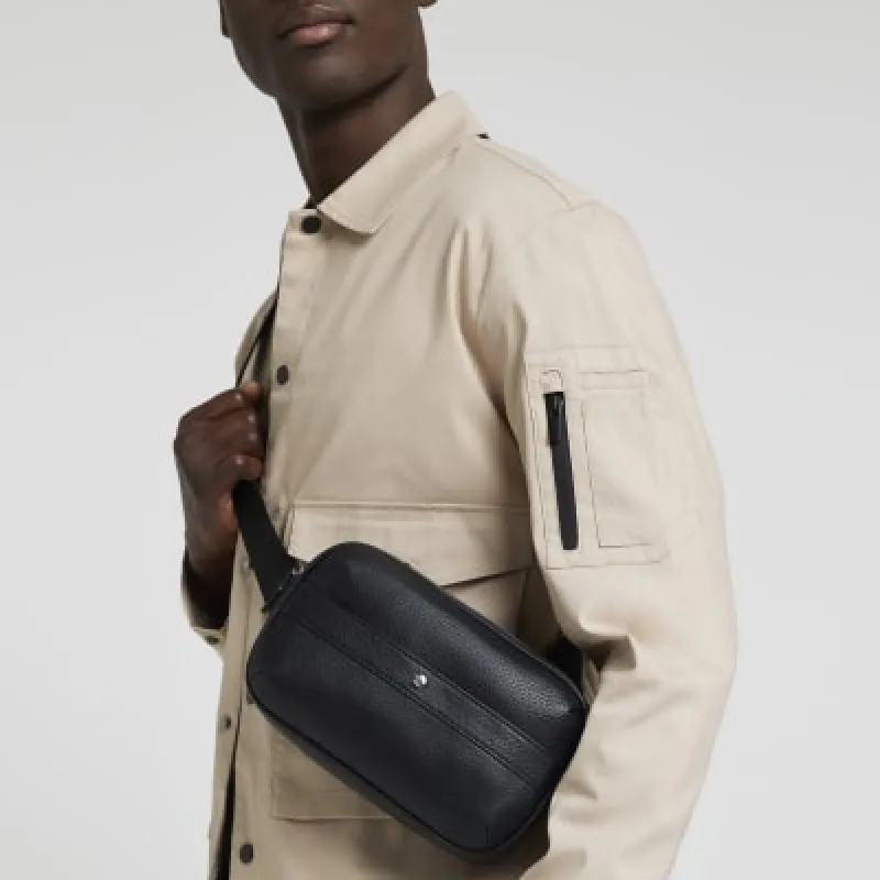 Black tumbled cross body bag sold by River Island