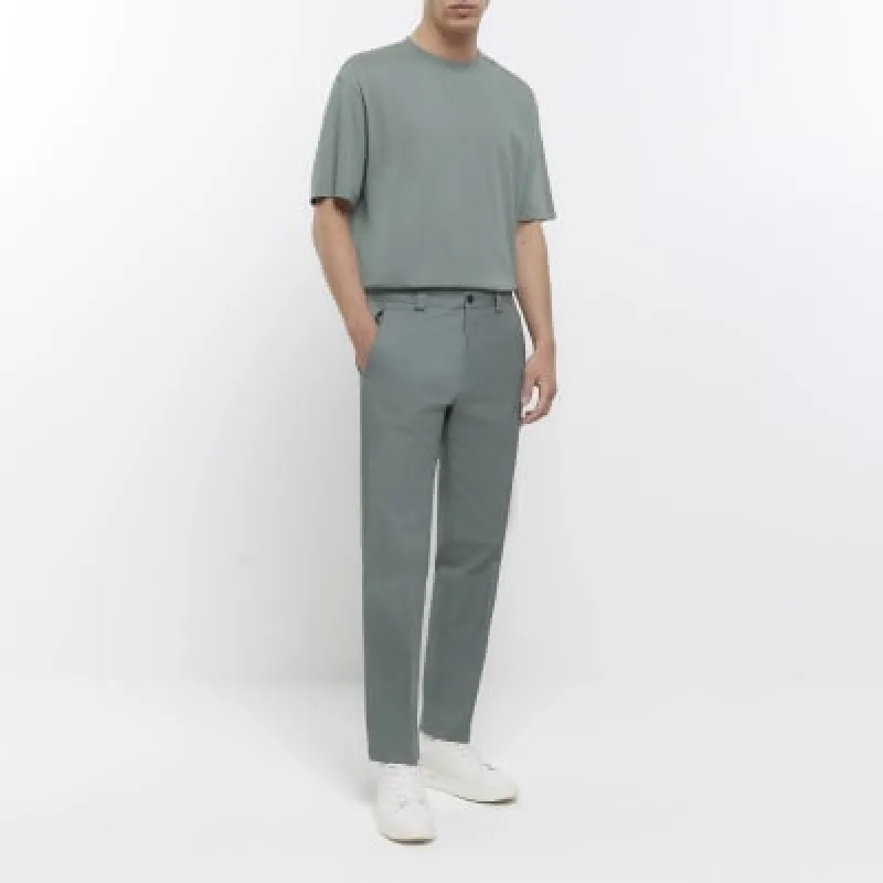 Green tapered fit smart trousers sold by River Island