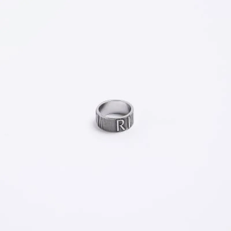 Silver colour RI logo ring sold by River Island