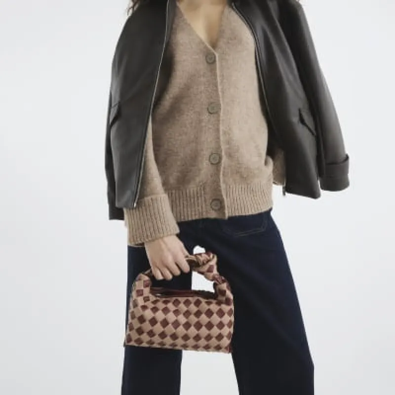 Red Faux Leather Knot Woven Clutch Bag sold by River Island