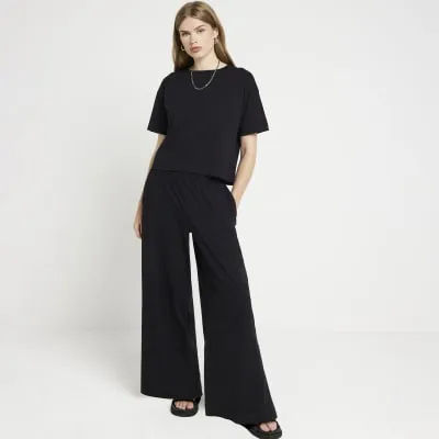 Black t-shirt and wide leg joggers set sold by River Island
