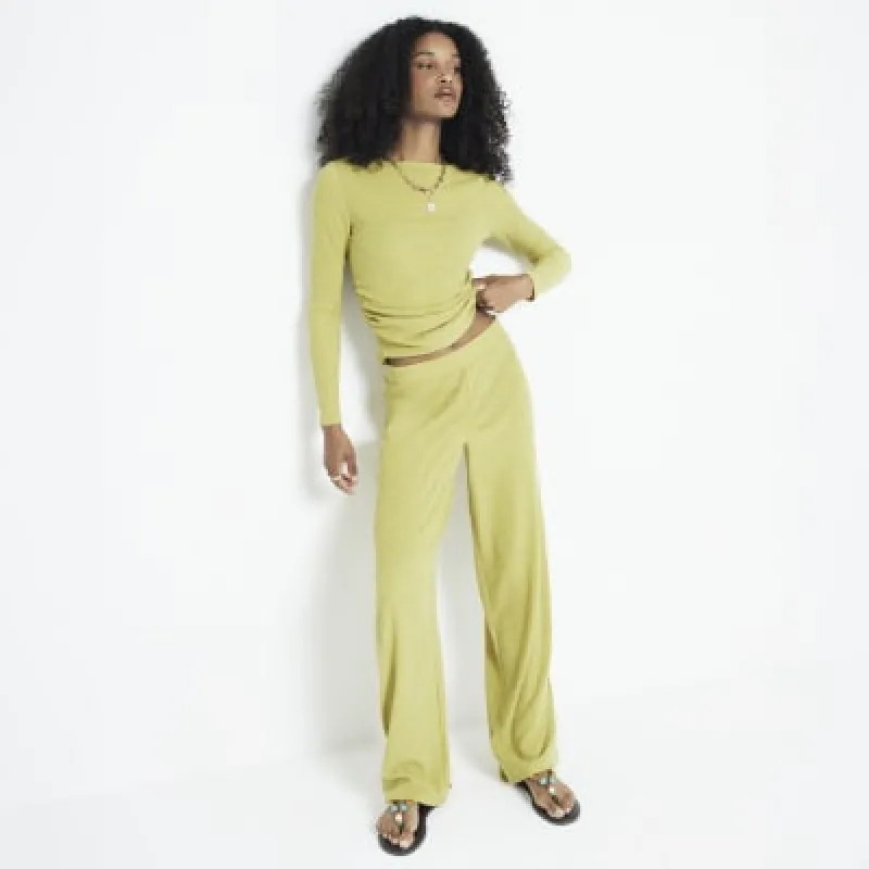 Green textured wide leg trousers sold by River Island