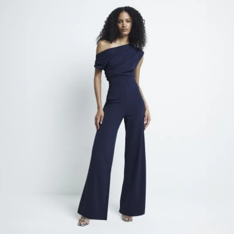 Navy drape off shoulder jumpsuit sold by River Island