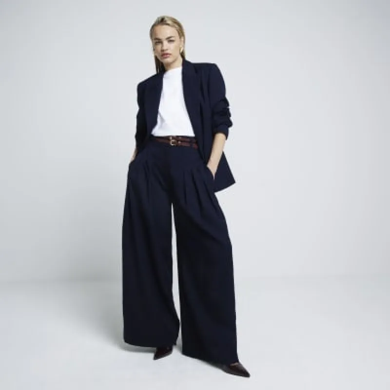Navy double belted wide leg trousers sold by River Island