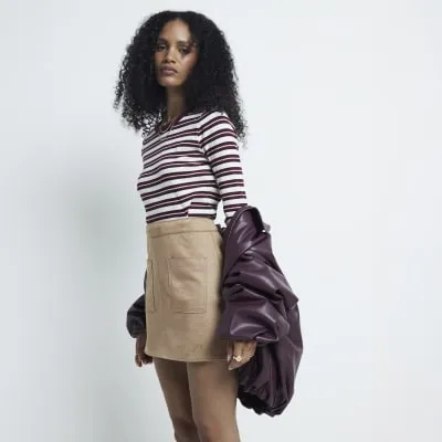Beige suedette pocket mini skirt sold by River Island
