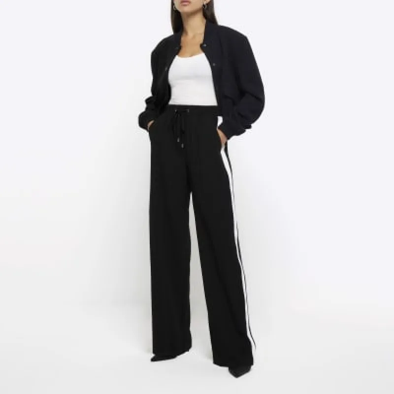 Black side stripe wide leg joggers sold by River Island