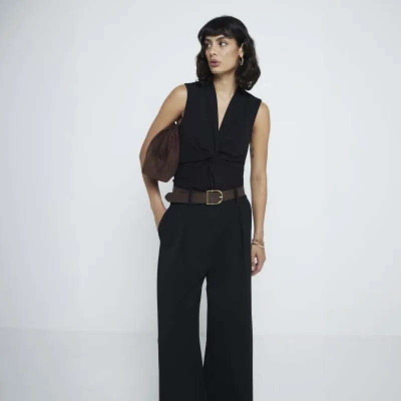 Black front knot vest top sold by River Island