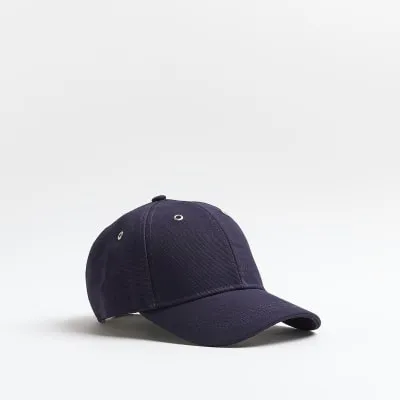 Navy canvas embroidered cap sold by River Island