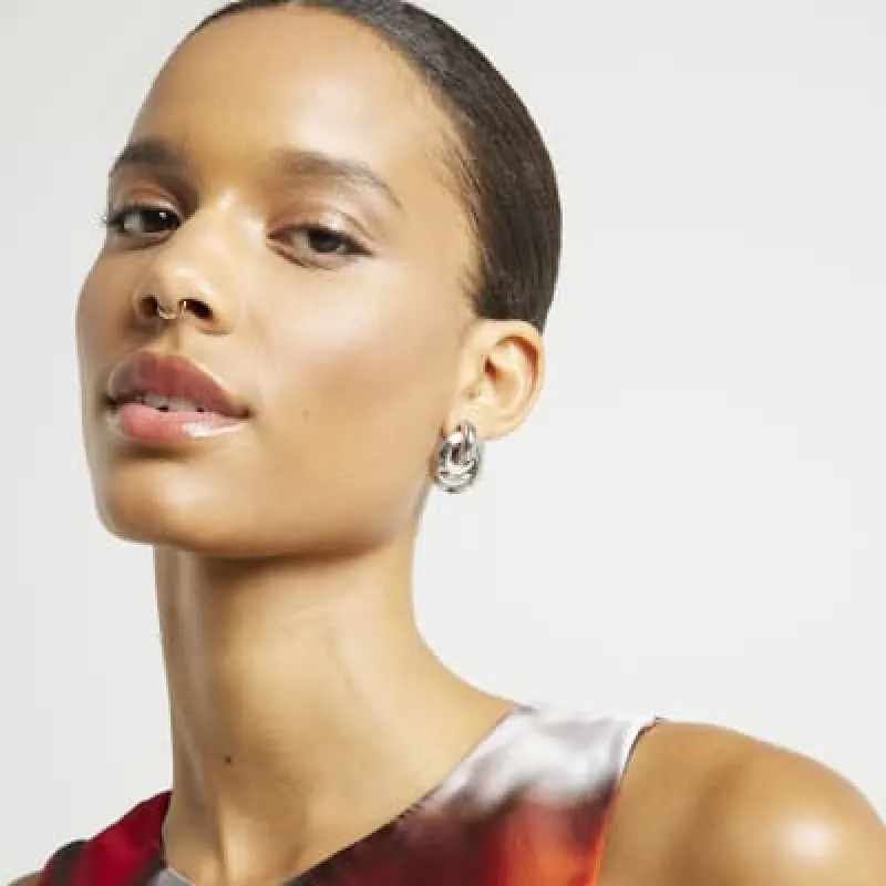 Silver knot stud earrings sold by River Island