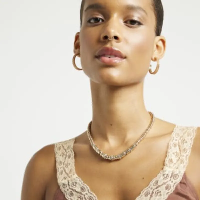 Gold pave beaded necklace sold by River Island