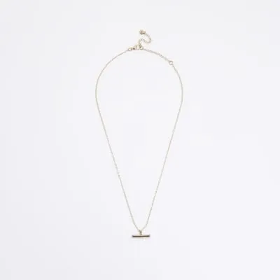 Gold February birth stone necklace sold by River Island