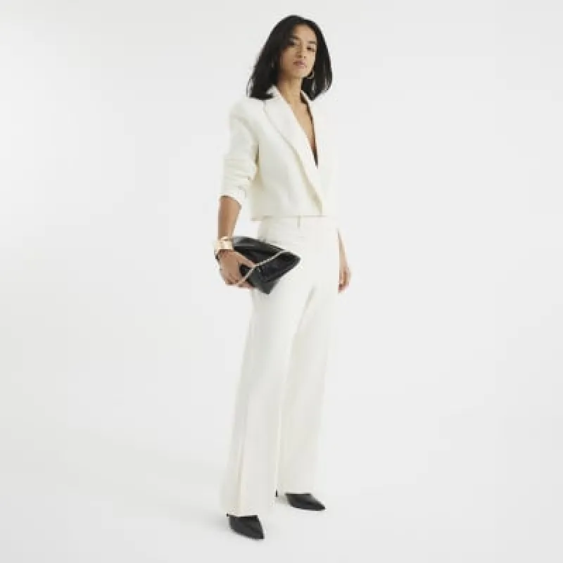 Petite Cream Tailored Flare Trousers sold by River Island