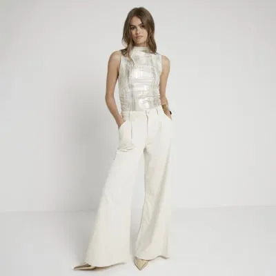 Gold foil high neck top sold by River Island