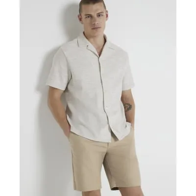 Beige slim fit chino shorts sold by River Island