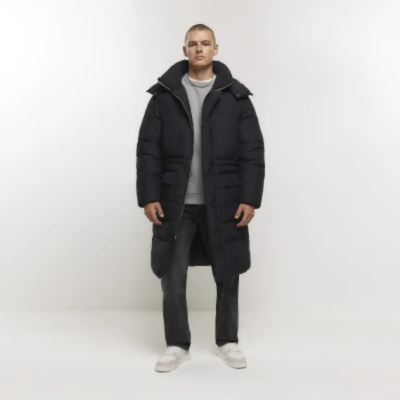 Black regular padded longline parka jacket sold by River Island