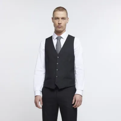 Black skinny fit twill waistcoat sold by River Island