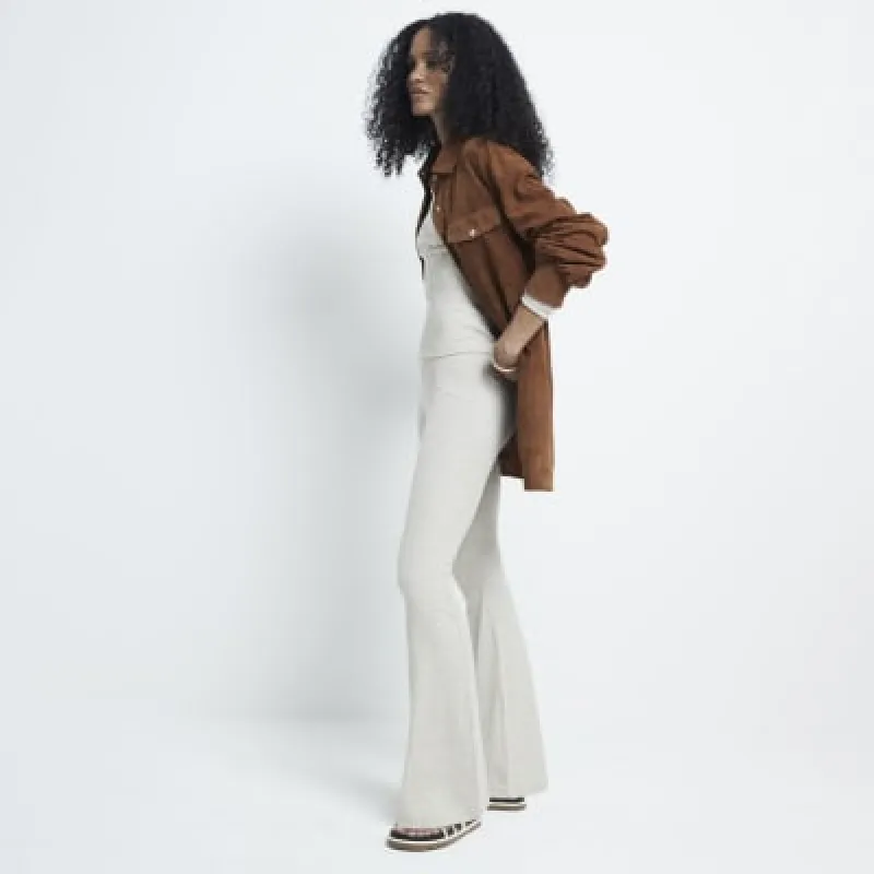 Beige high waisted ribbed flared leggings sold by River Island