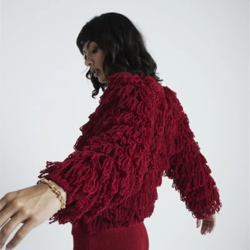 Red knit fringe jumper sold by River Island