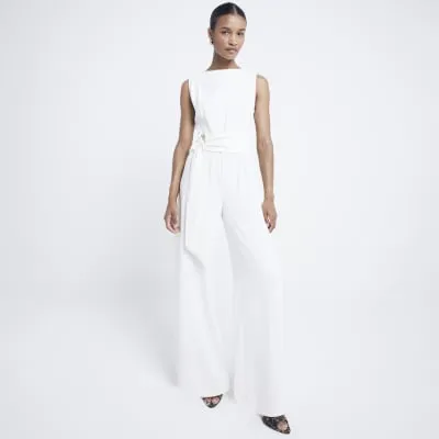 Cream belted jumpsuit sold by River Island