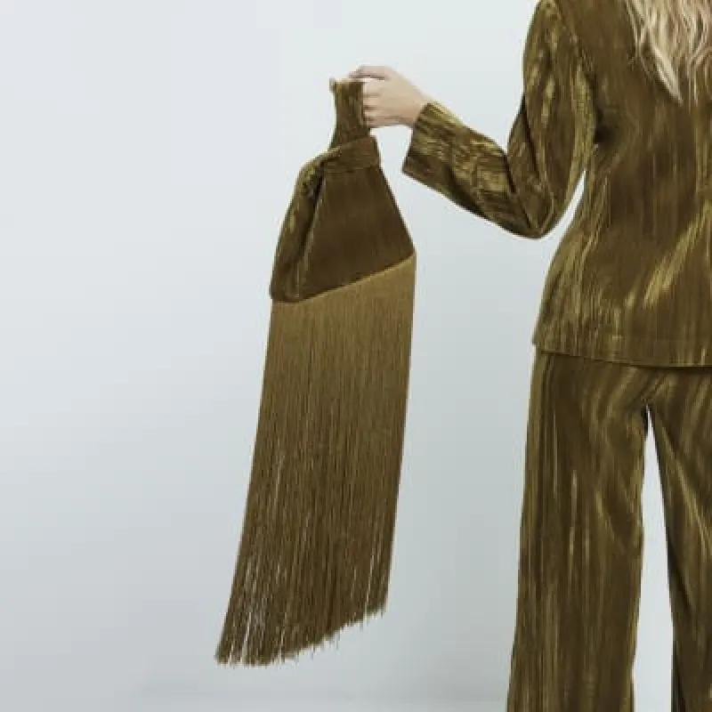 Green tassel clutch bag sold by River Island