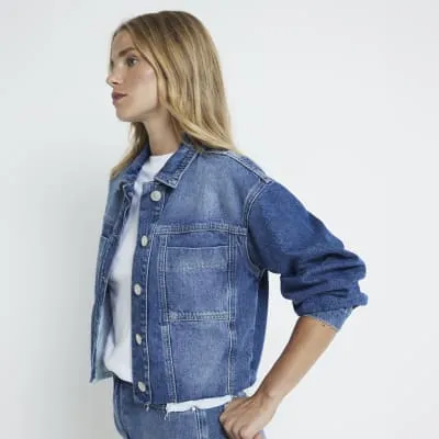 Blue crop denim trucker jacket sold by River Island