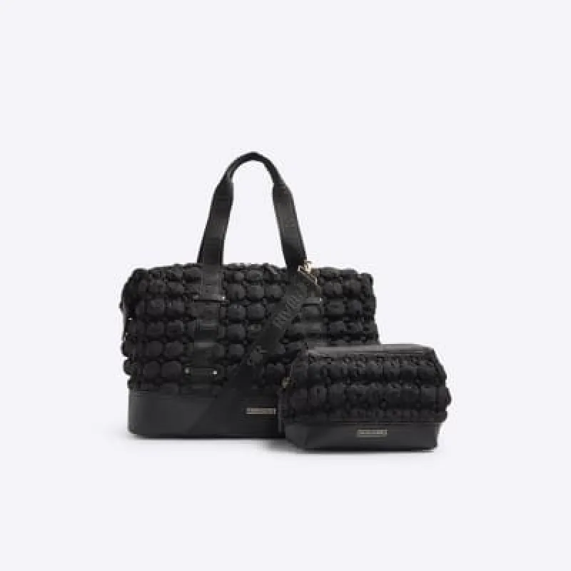 Black quilted texture travel and makeup bag sold by River Island
