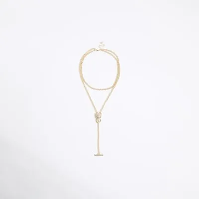 Gold leopard head necklace sold by River Island