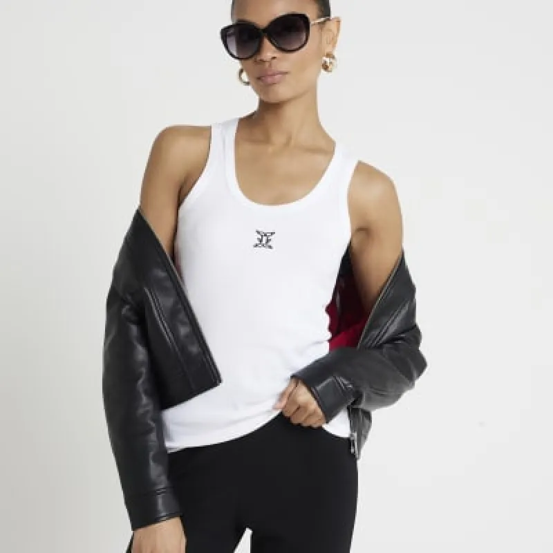 White embroidered vest top sold by River Island