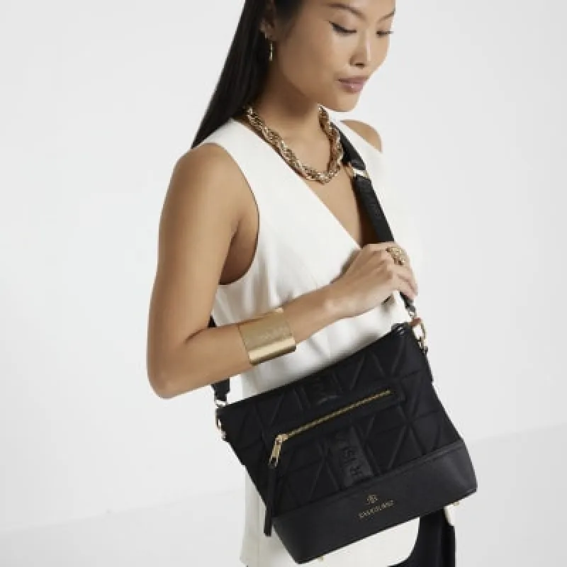 Black webbing quilted cross body bag sold by River Island