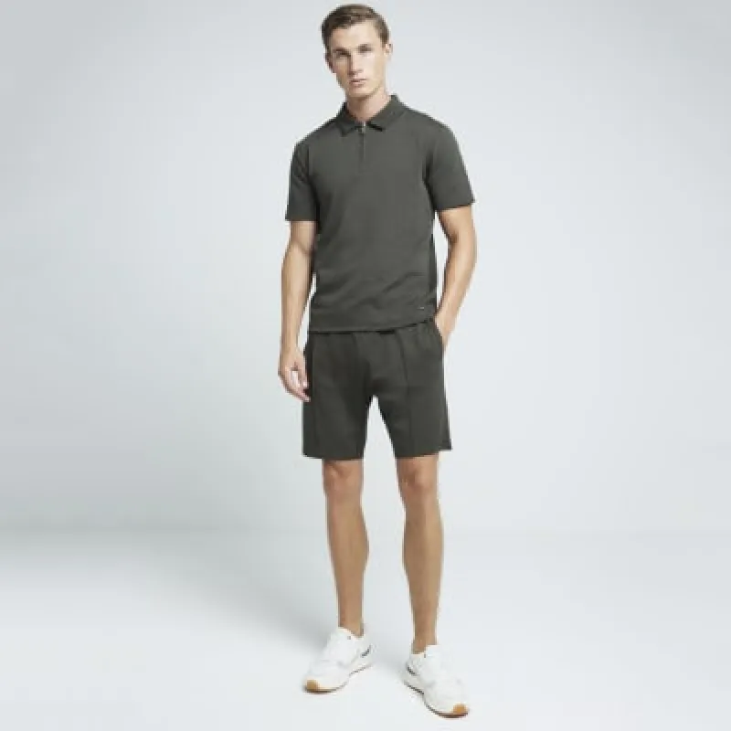 Khaki slim fit stretch textured half zip polo sold by River Island
