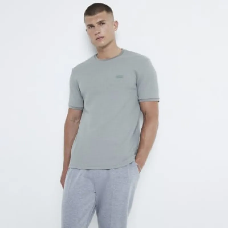 Khaki slim fit textured badge t-shirt sold by River Island