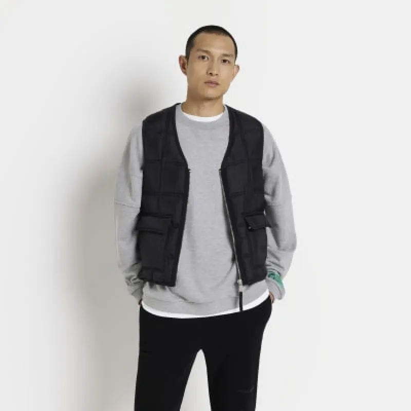 Black regular fit quilted zip up gilet sold by River Island