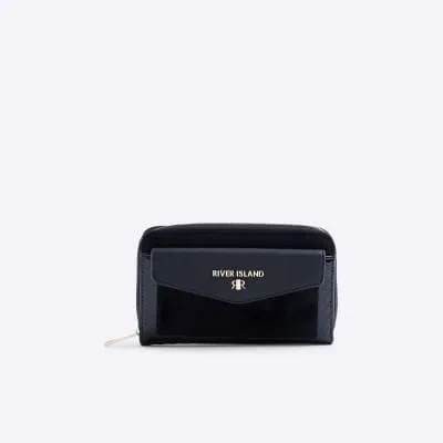 Black embossed monogram envelope purse sold by River Island