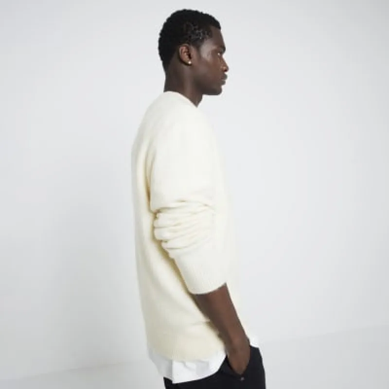 Yellow relaxed fit crew neck jumper sold by River Island