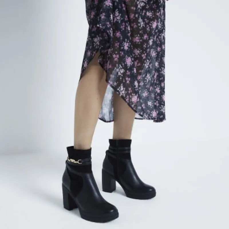 Black heeled boots sold by River Island