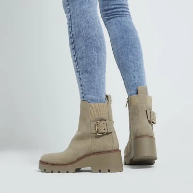 Beige wide fit buckle detail chelsea boots sold by River Island