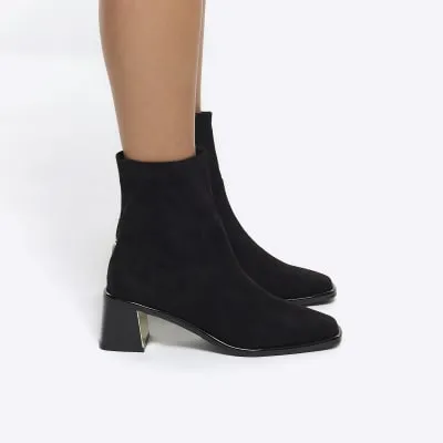 Black block heel ankle boots sold by River Island