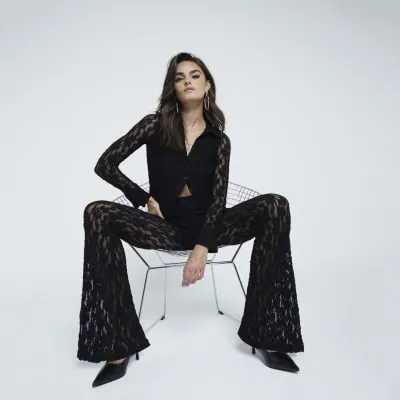 Black Lace Flared Trousers sold by River Island