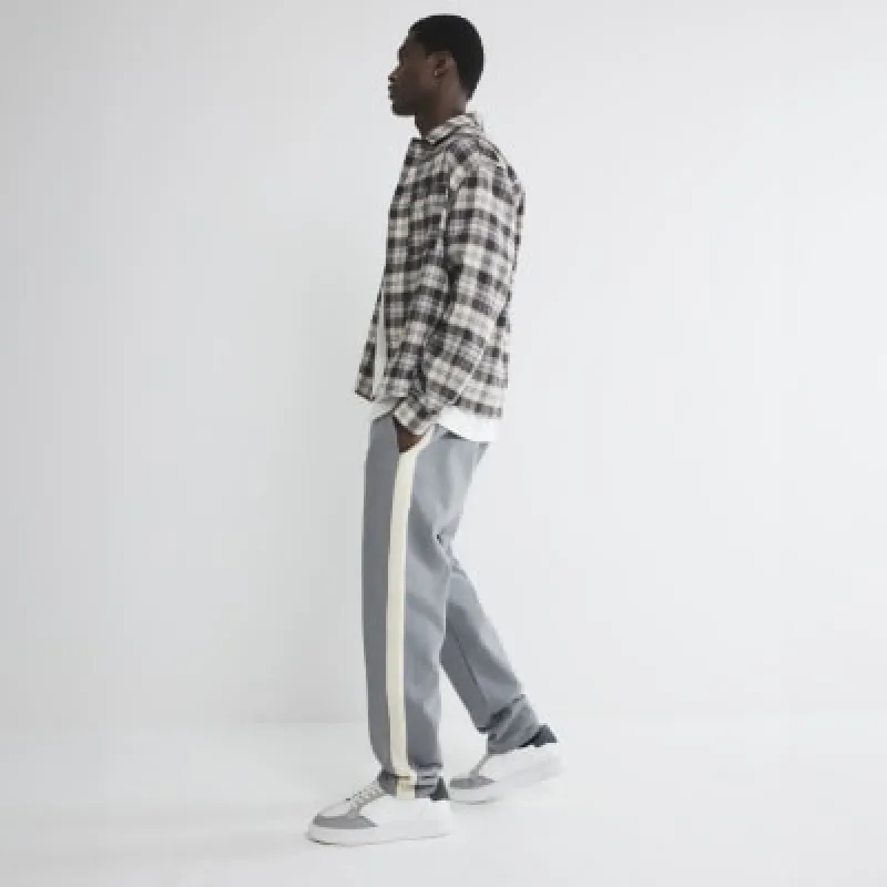 Grey Regular Fit Taped Joggers sold by River Island