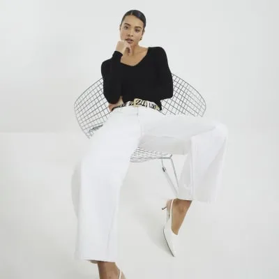 Black Long Sleeve V-Neck Tencel Top sold by River Island